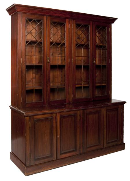 Appraisal: A late th century large mahogany bookcase the projected moulded