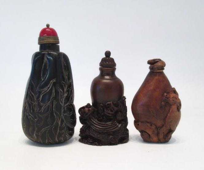 Appraisal: THREE CHINESE CARVED WOOD AND FAUX WOOD SNUFF BOTTLES each