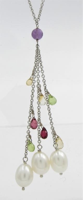 Appraisal: A thoughtful and stunning lariat style drop necklace featuring three