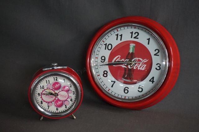 Appraisal: Coca-Cola Pair of Battery Operated Clocks One round wall clock