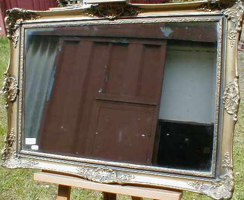 Appraisal: A modern and gilt framed wall mirror