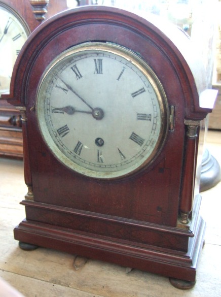 Appraisal: An Edwardian inlaid mahogany mantel clock the arch top over