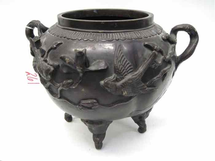 Appraisal: CHINESE BRONZE FOUR-FOOTED POT with flowering branches forming the side