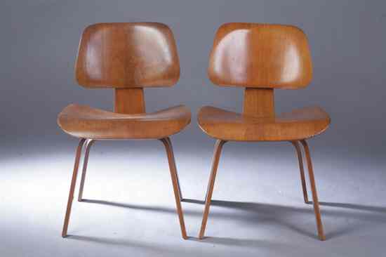 Appraisal: PAIR CHARLES AND RAY EAMES ASH LOUNGE CHAIRS Designed by