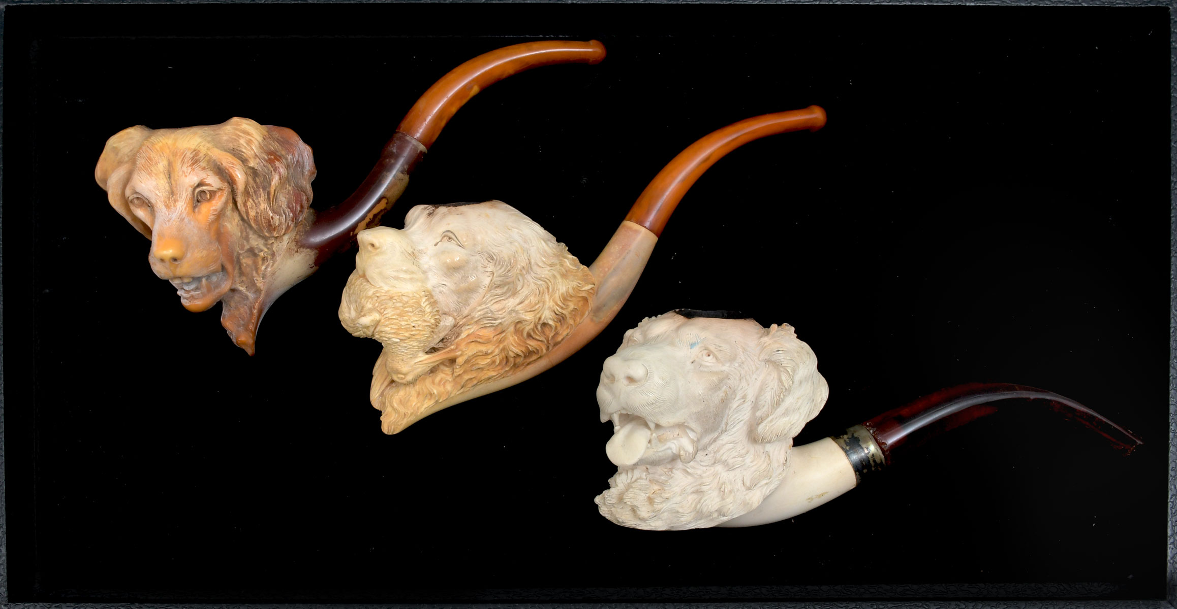 Appraisal: MEERSCHAUM HUNTING DOG LOT Largest Approx '' l x ''