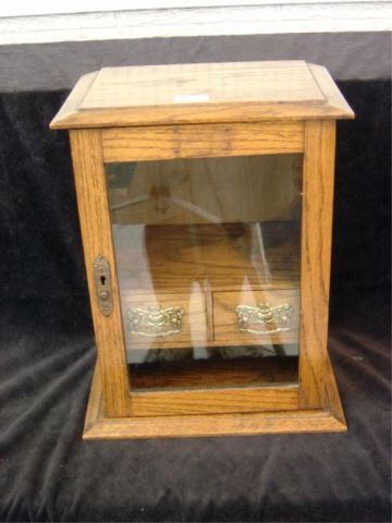 Appraisal: OAK GLASS PIPE CABINET