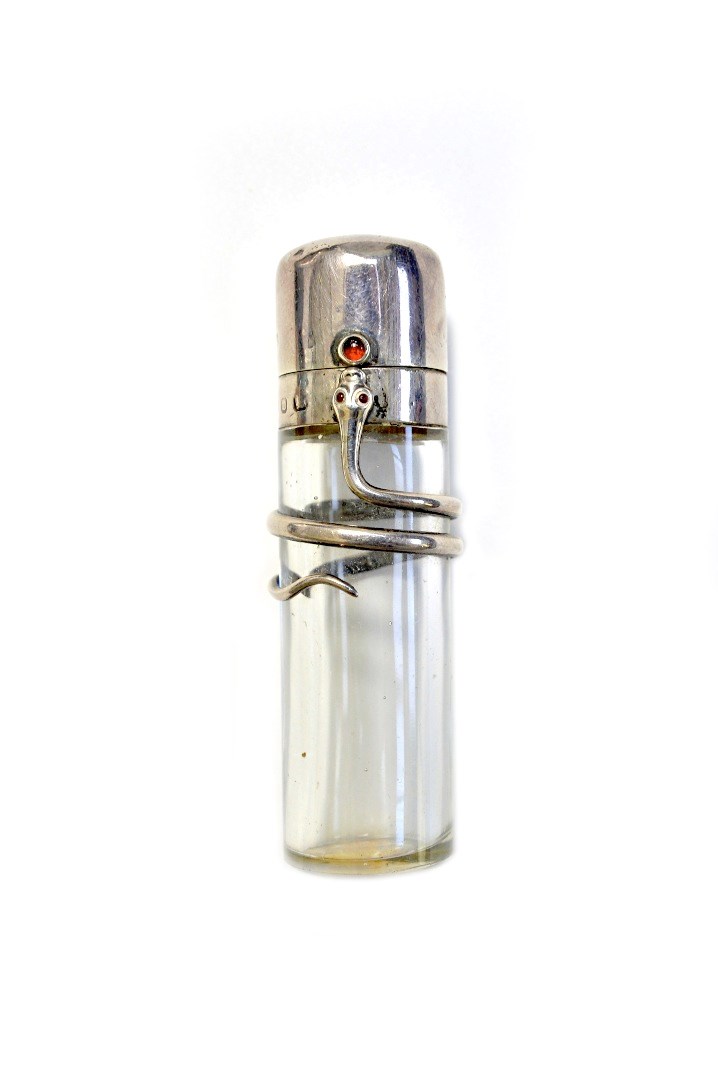 Appraisal: A glass and silver mounted scent bottle hallmarked Birmingham the