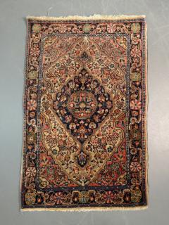 Appraisal: Sarouk mat with floral patterns ' x '