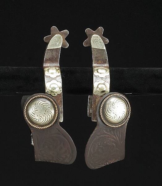 Appraisal: A pair of silver-mounted spurs by Crockettcirca s s Single