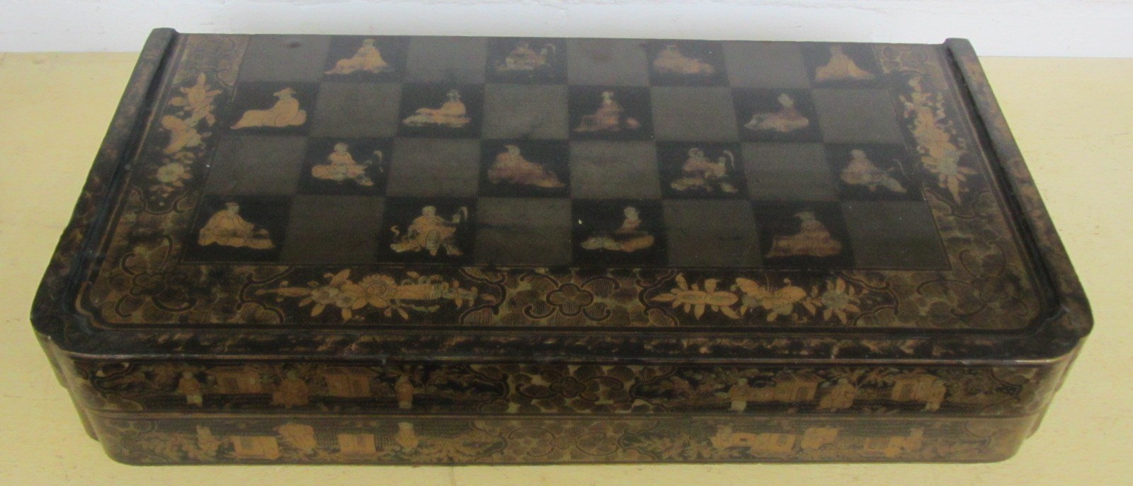 Appraisal: A th century black lacquer chinoiserie decorated folding chess backgammon