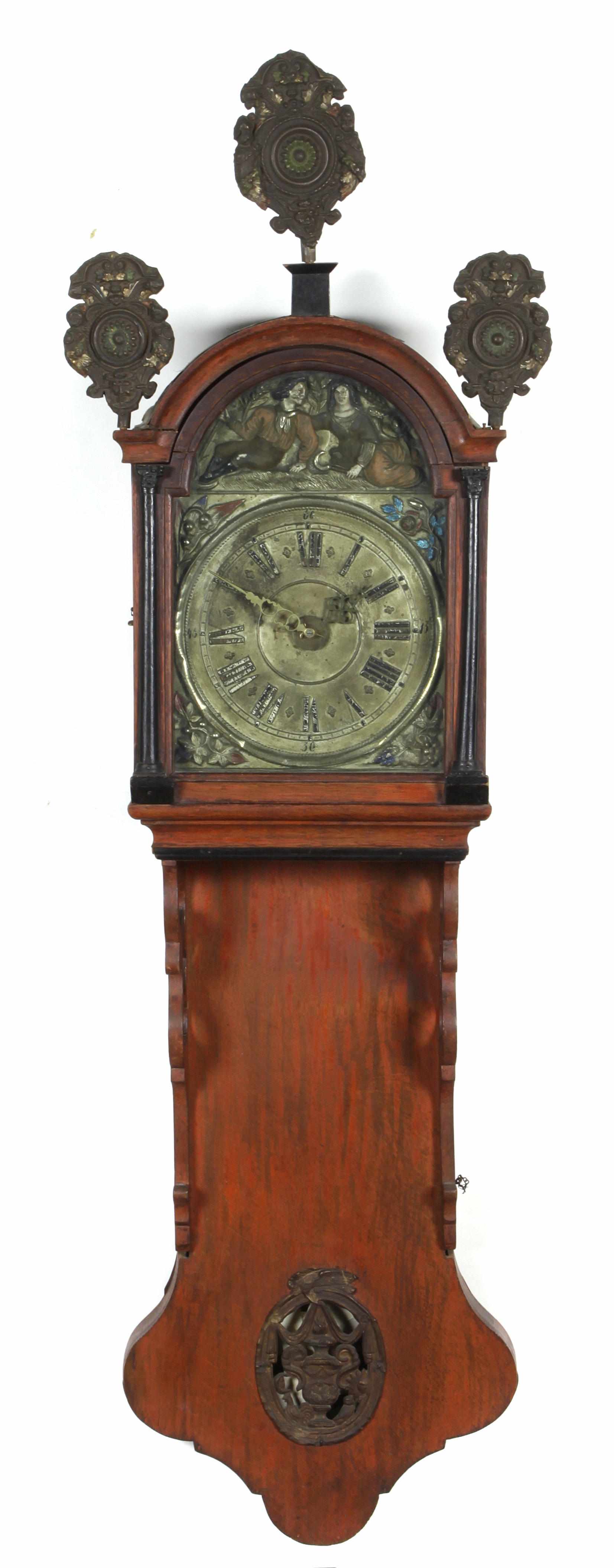 Appraisal: A Continental fruitwood and ebonized Friesland wall clock height in