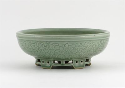 Appraisal: A Chinese celadon shallow bowl the exterior carved with a