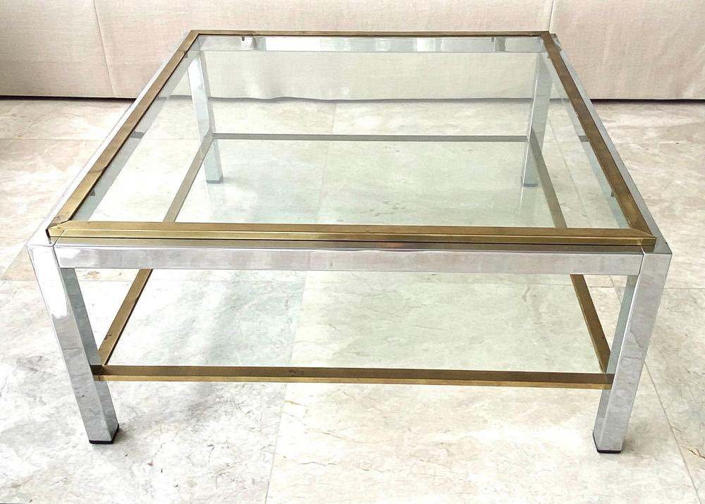 Appraisal: CONTEMPORARY BRASS AND STEEL COCKTAIL TABLEThe square inset glass top