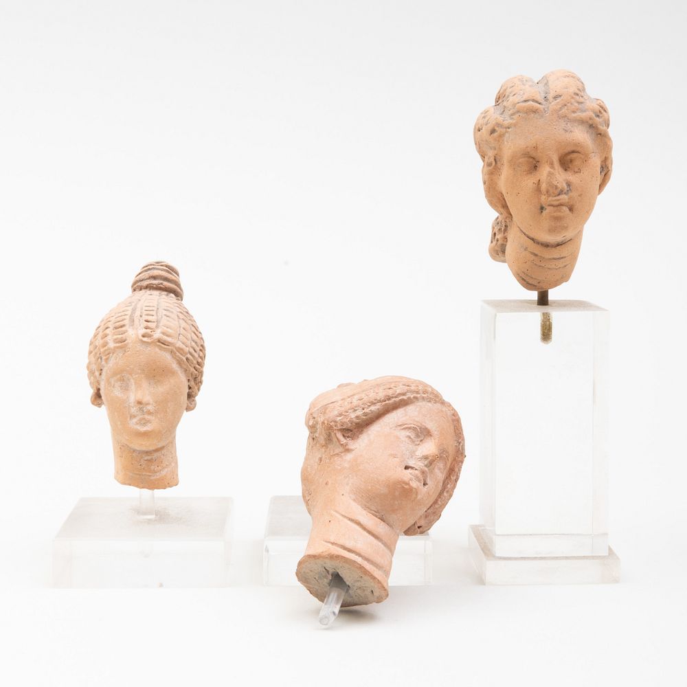 Appraisal: Group of Three Greek Terracotta Heads of Women All raised