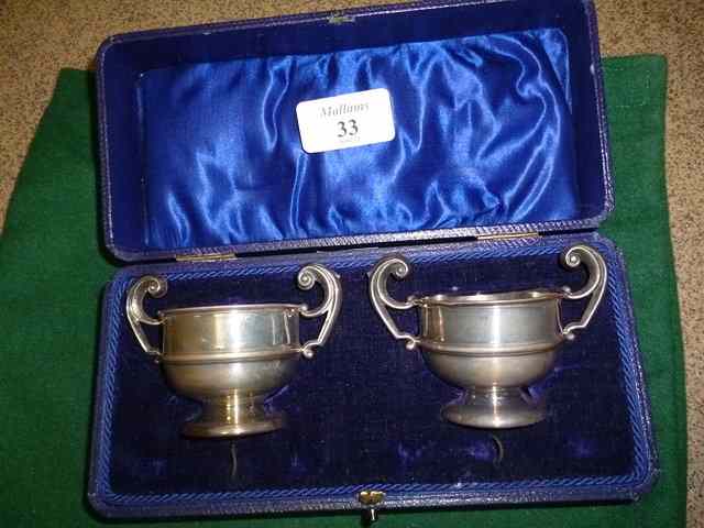 Appraisal: A CASED SET OF SILVER SALTS of pedestal bowl form