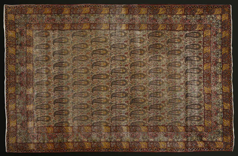 Appraisal: A Persian Kirman botha design carpet A Persian Kirman botha