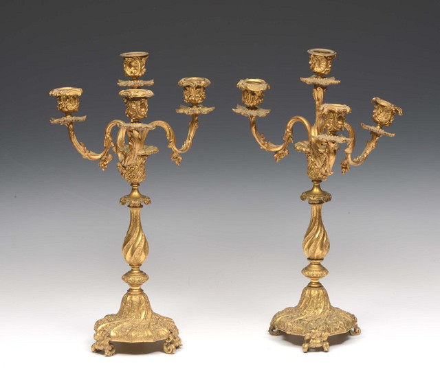 Appraisal: A PAIR OF FRENCH ORMOLU THREE BRANCH CANDELABRA Rococo style