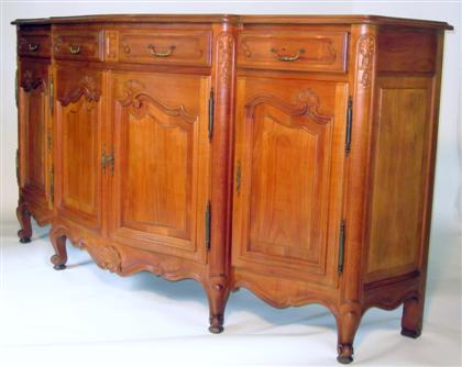 Appraisal: French provincial style walnut buffet The shaped top over four