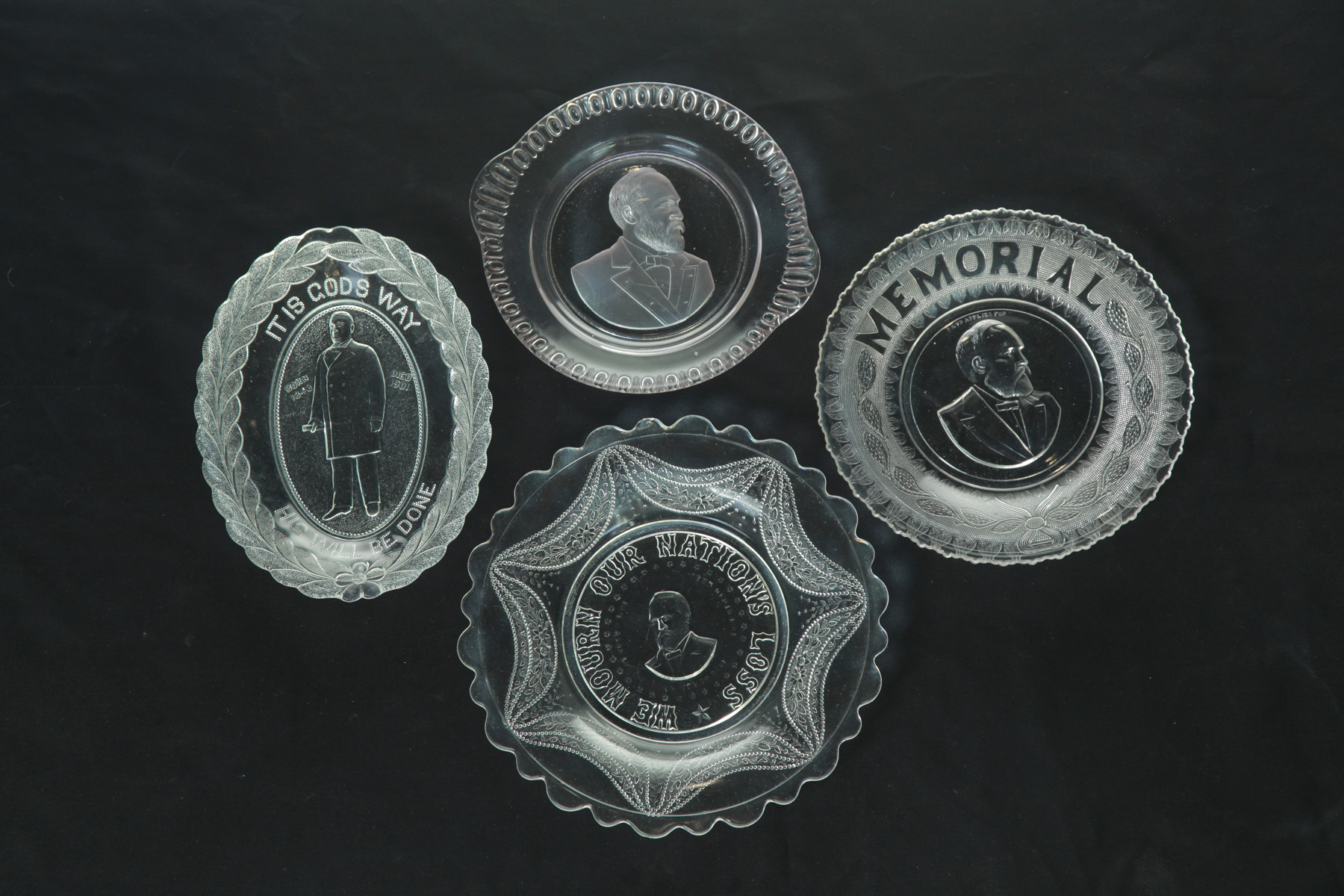 Appraisal: FOUR PRESIDENTIAL PRESSED GLASS MEMORIAL BREAD PLATES INCLUDING THREE GARFIELD