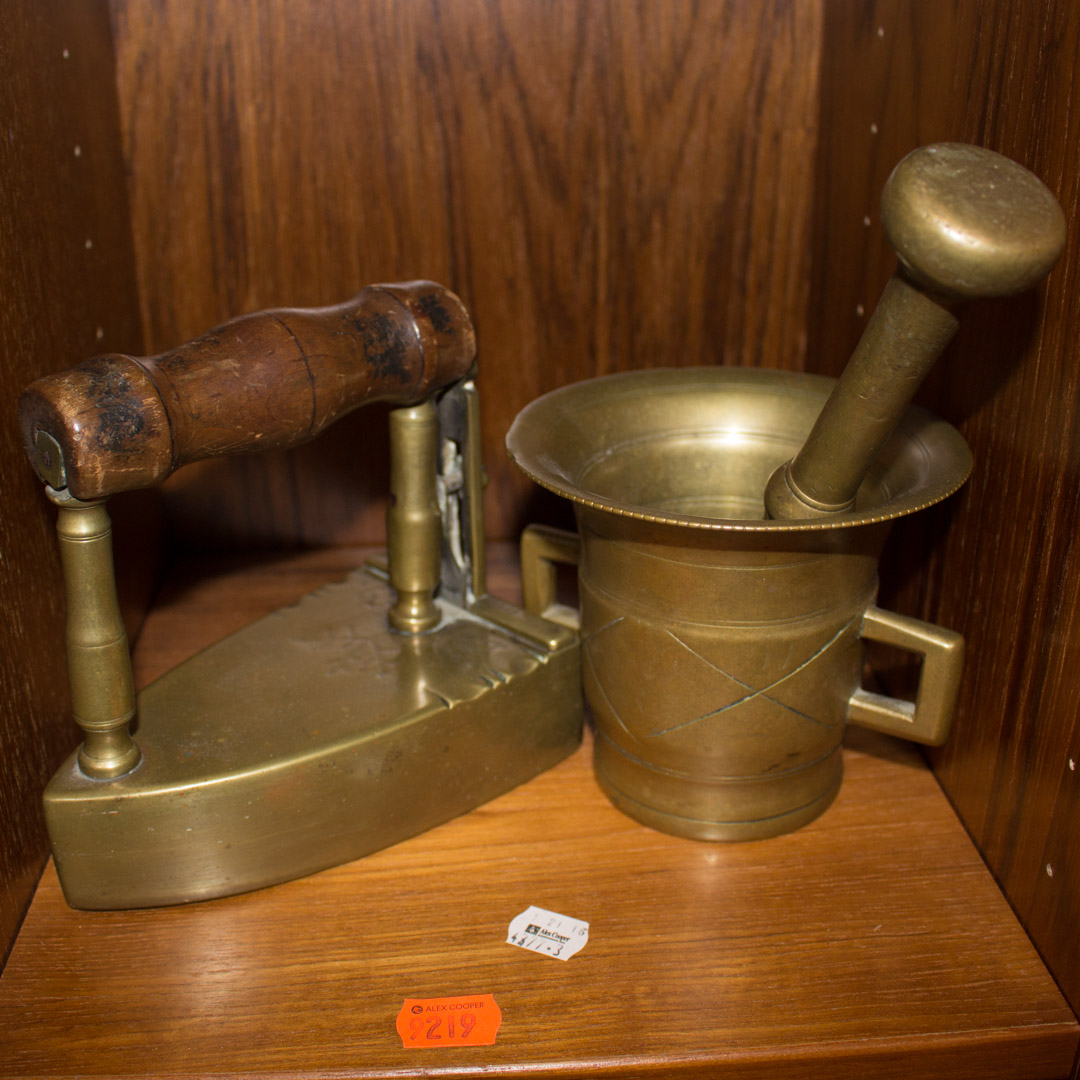 Appraisal: Brass andiron and a mortar and pestle