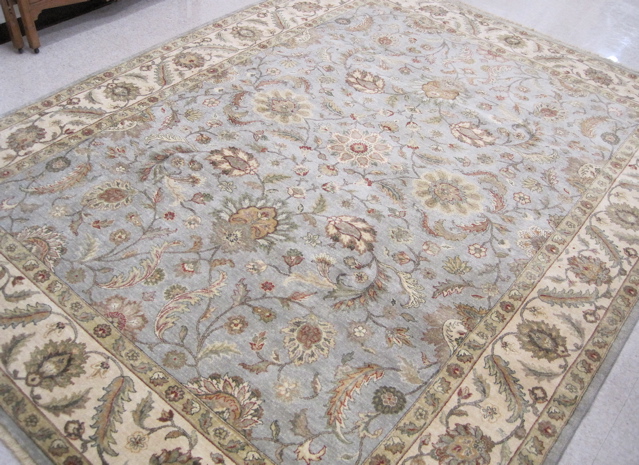 Appraisal: HAND KNOTTED ORIENTAL CARPET Pakistani-Persian overall floral design on light