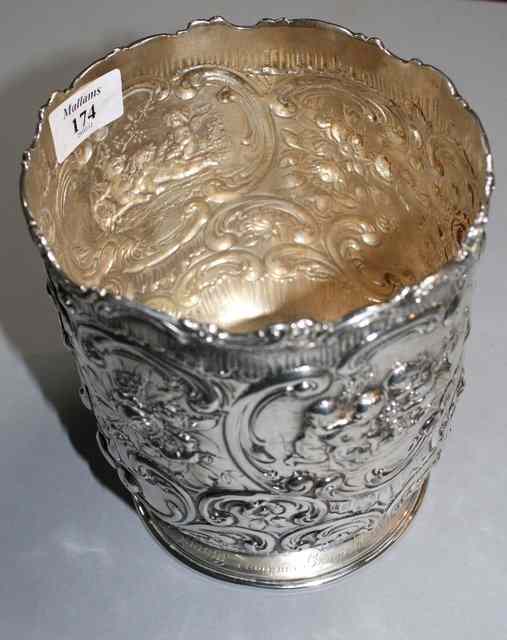 Appraisal: A CONTINENTAL SILVER WINE COOLER chased with cherubs scrolls and