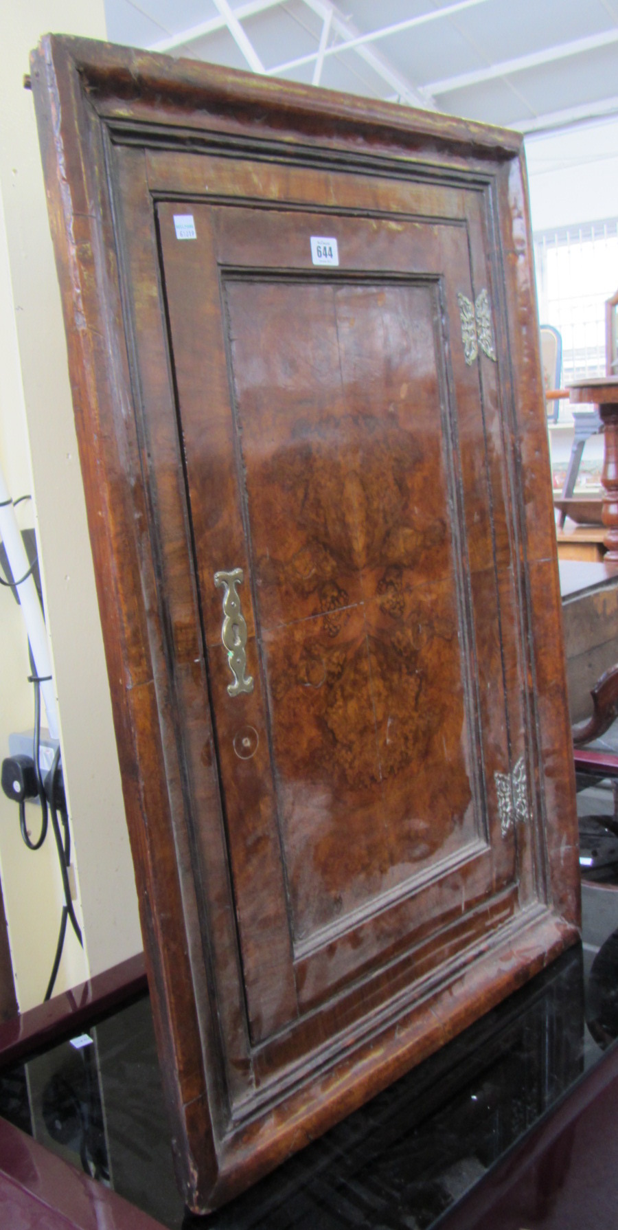 Appraisal: An th century walnut single door hanging corner cupboard cm