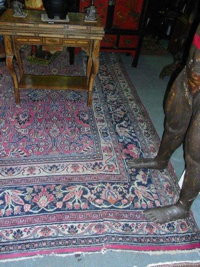 Appraisal: A LARGE KIRMAN RED GROUND CARPET with all over trailing