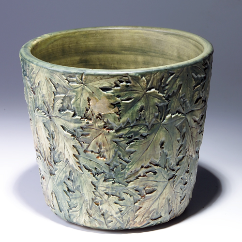 Appraisal: WELLER planter beautifully embossed with falling leaves Tight line through