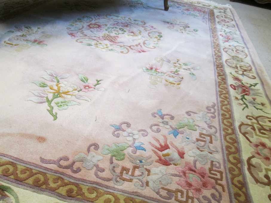 Appraisal: A CONTEMPORARY CHINESE CARPET traditional central medallion and simple floral