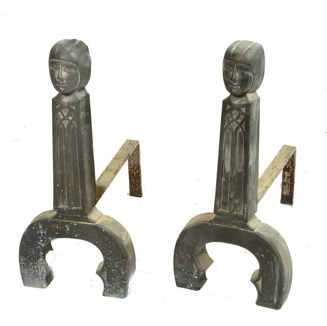 Appraisal: A PAIR OF BRONZE FIRE DOGS with stylised mask and