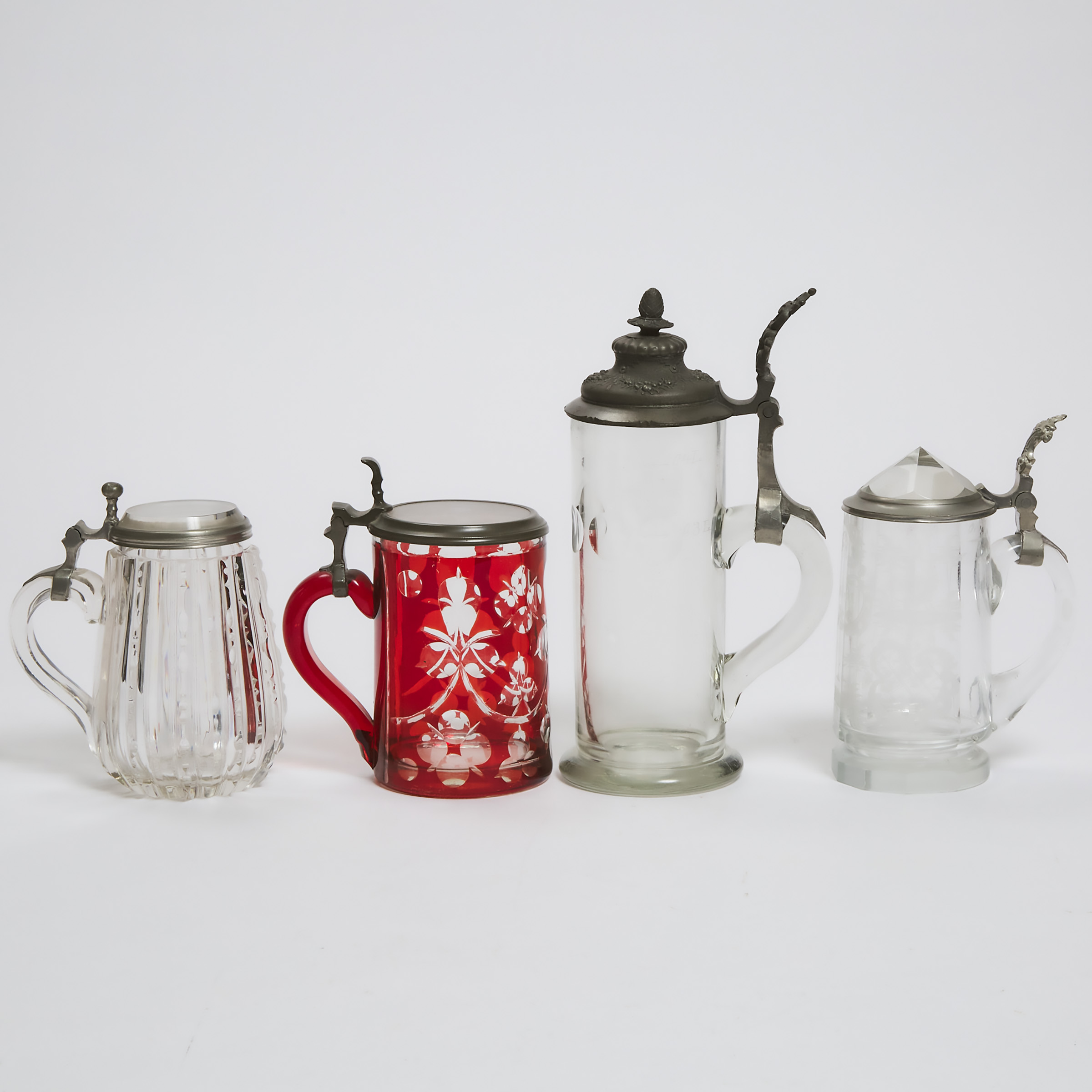 Appraisal: Four Bohemian Pewter Mounted Cut Glass Tankards second half of