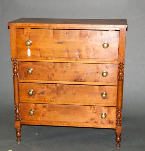 Appraisal: a Empire Walnut Four Drawer Chest Carved baluster form half