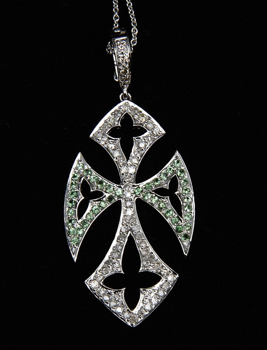 Appraisal: DIAMOND AND TSAVORITE CROSS kt white gold stylized cross is