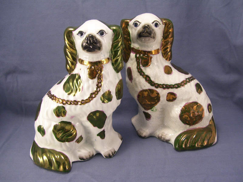 Appraisal: Pair Staffordshire Comforter Luster Spaniels White and copper luster spaniels