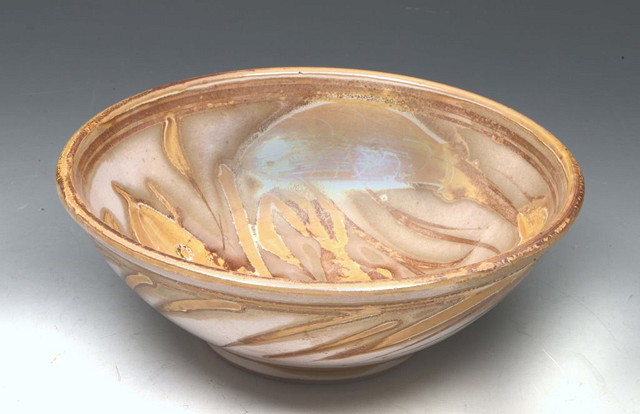 Appraisal: MOHAMMED HAMID British - A lustre bowl with fish decoration