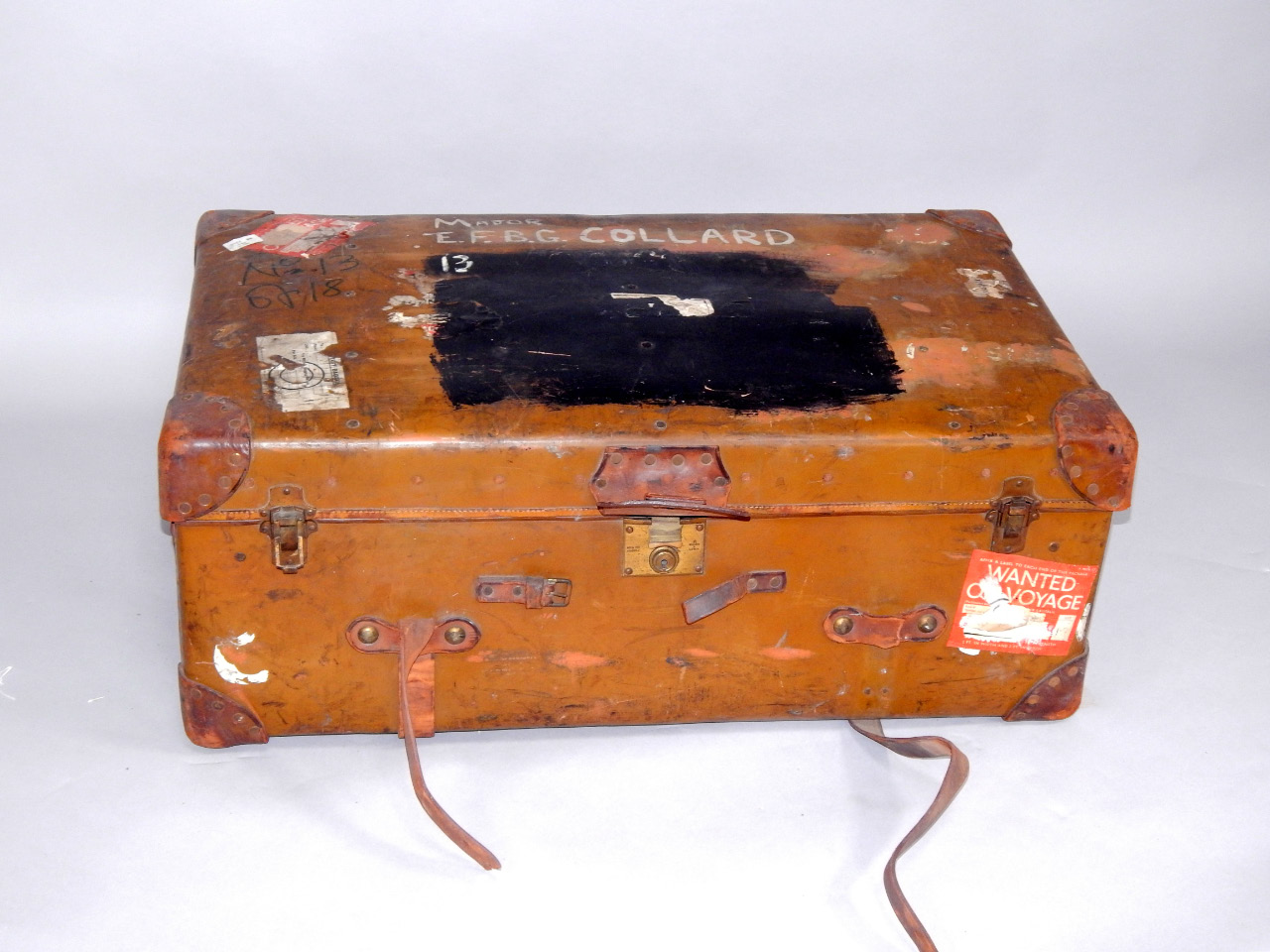 Appraisal: An Orient Make tan leather cabin trunk bearing partial luggage