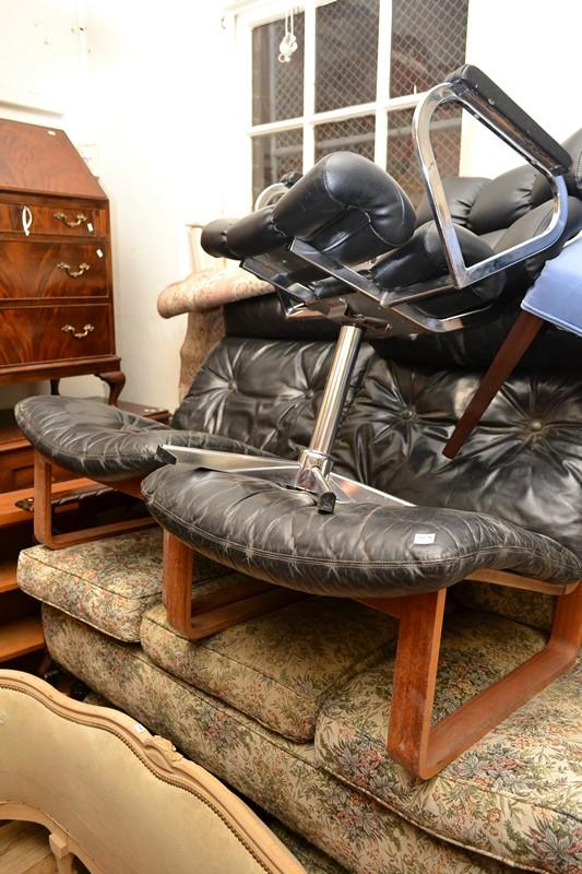 Appraisal: A PAIR OF TESSA T ARMCHAIRS IN BLACK LEATHER UPHOLSTERY