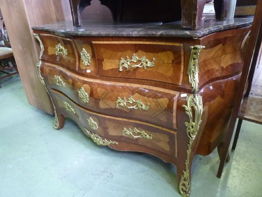 Appraisal: A reproduction bombe commode with polished marble top AF over