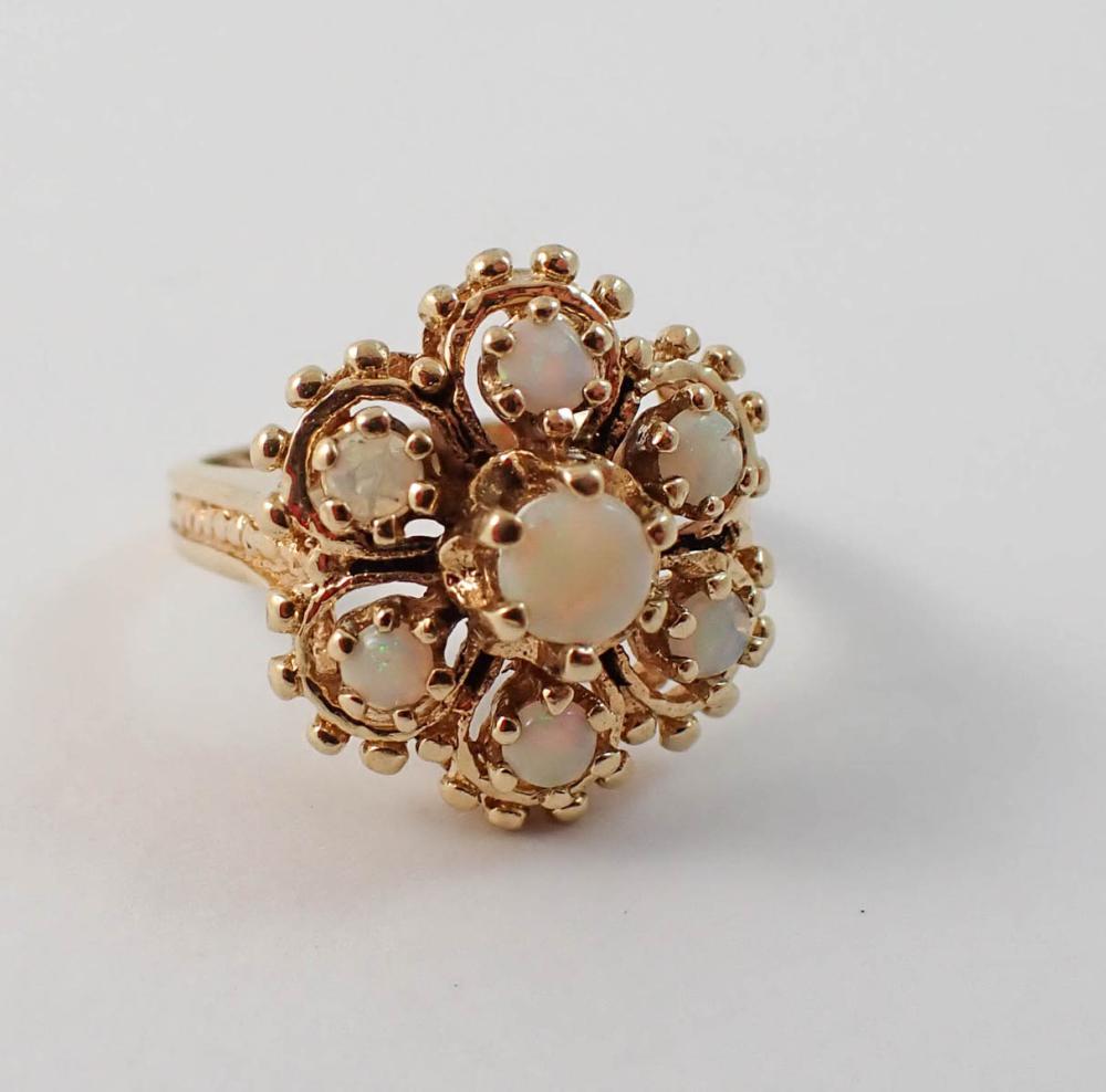 Appraisal: OPAL AND YELLOW GOLD CLUSTER RING The k yellow gold