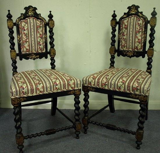 Appraisal: A pair of Victorian ebonised side chairs the upholstered panel