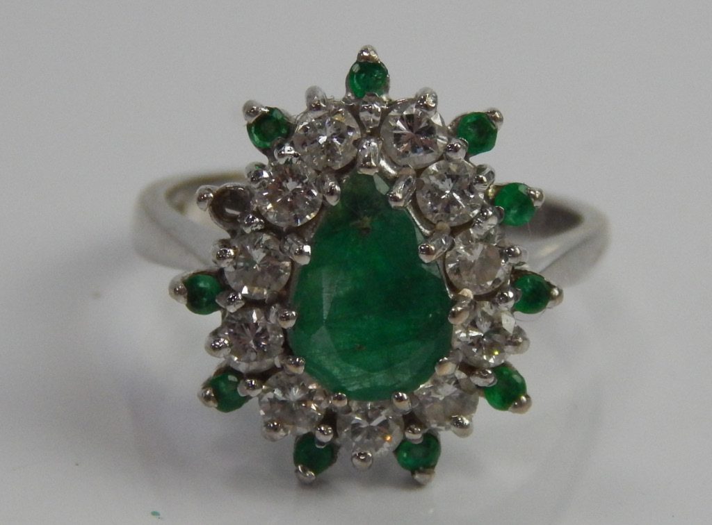 Appraisal: An ct white gold dress ring with emerald and diamond