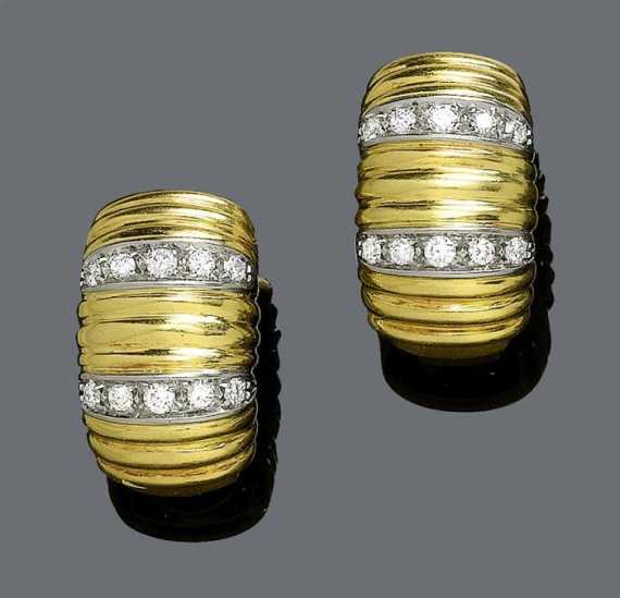 Appraisal: GOLD AND DIAMOND EARCLIPS Yellow and white gold g Casual-elegant