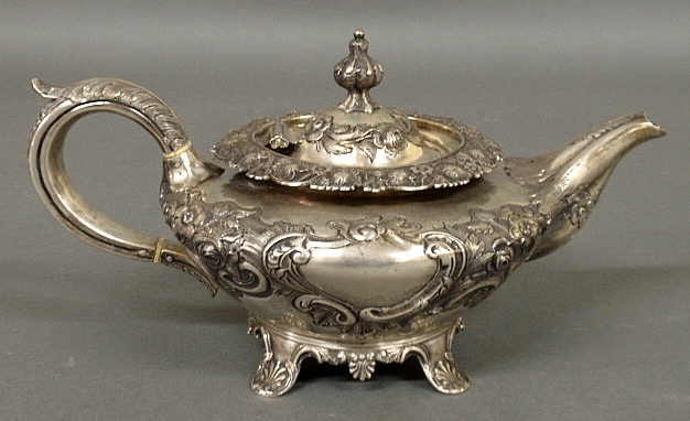 Appraisal: - Continental silver teapot with repouss and chased floral decoration