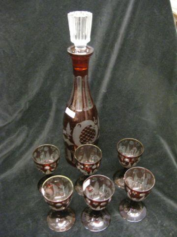 Appraisal: Bohemian Ruby Cut-to-Clear Decanter and Wine glasses castle stag and