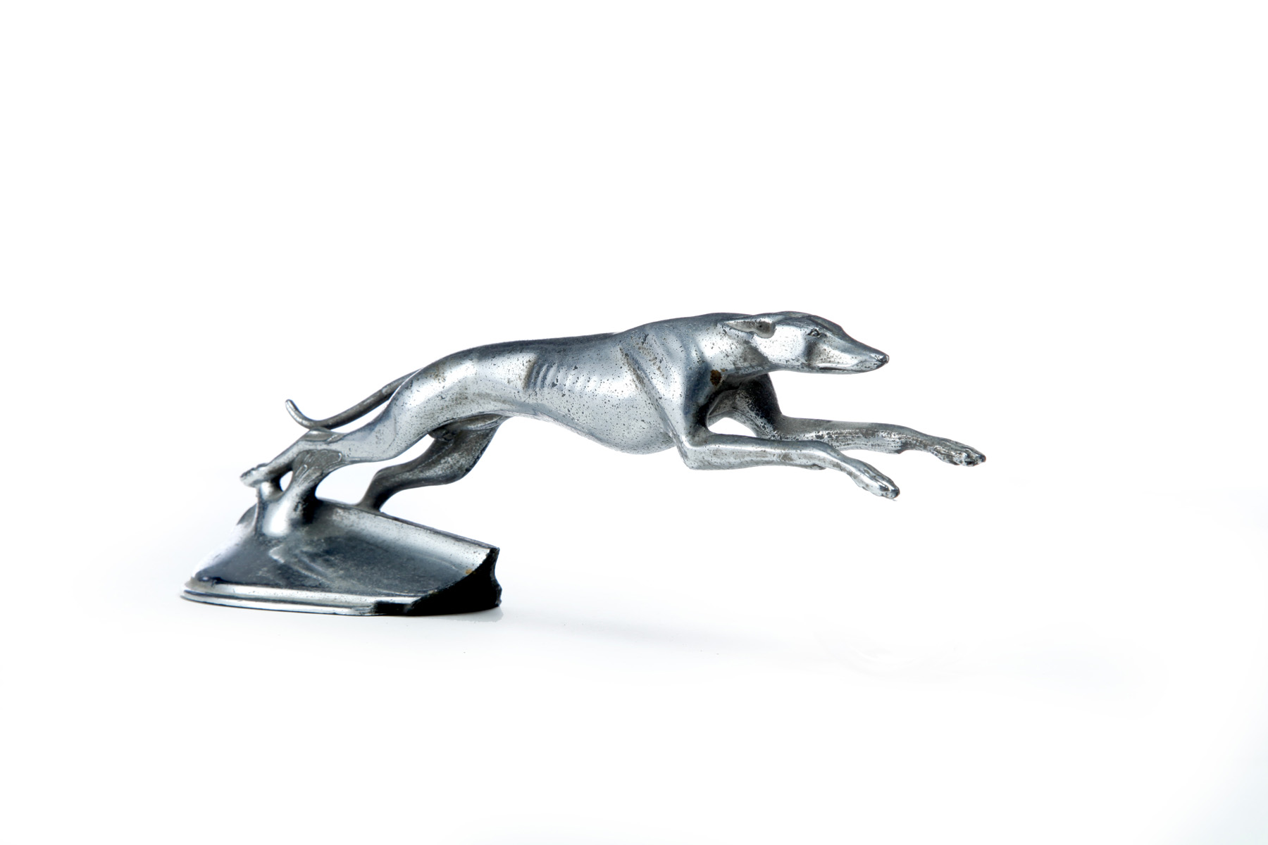 Appraisal: GREYHOUND HOOD ORNAMENT American th century Depicts a greyhound mid-sprint