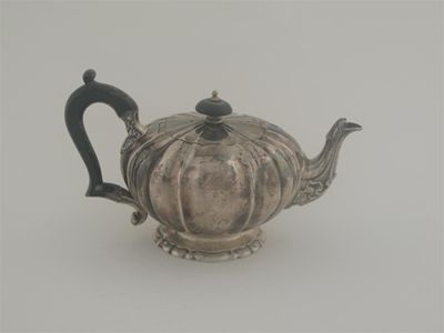 Appraisal: A George IV bachelor's teapot with a decorative spout and