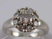 Appraisal: A French hallmarked carat white gold diamond cluster ring the