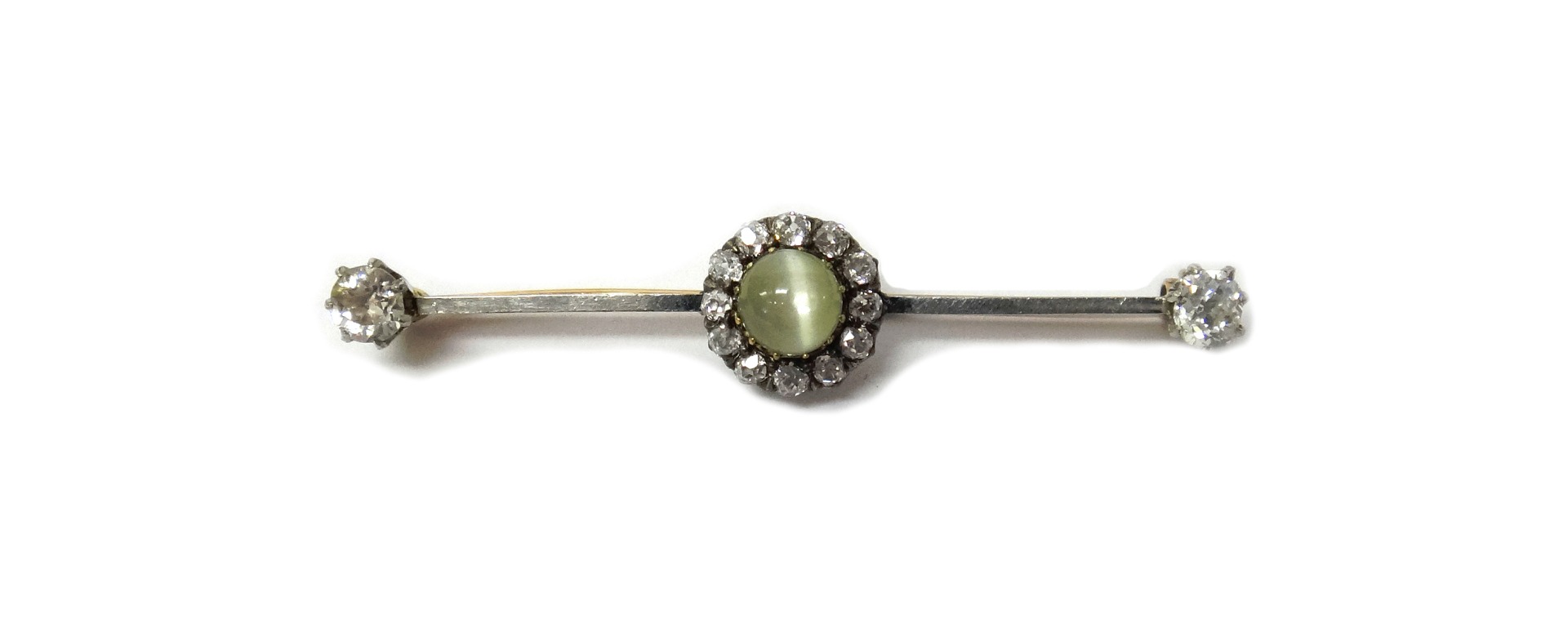 Appraisal: A diamond and cat's eye set cluster bar brooch mounted