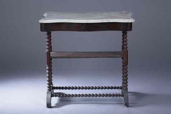 Appraisal: VICTORIAN CARVED MAHOGANY MARBLE-TOP SIDE TABLE Late th century Molded-edge